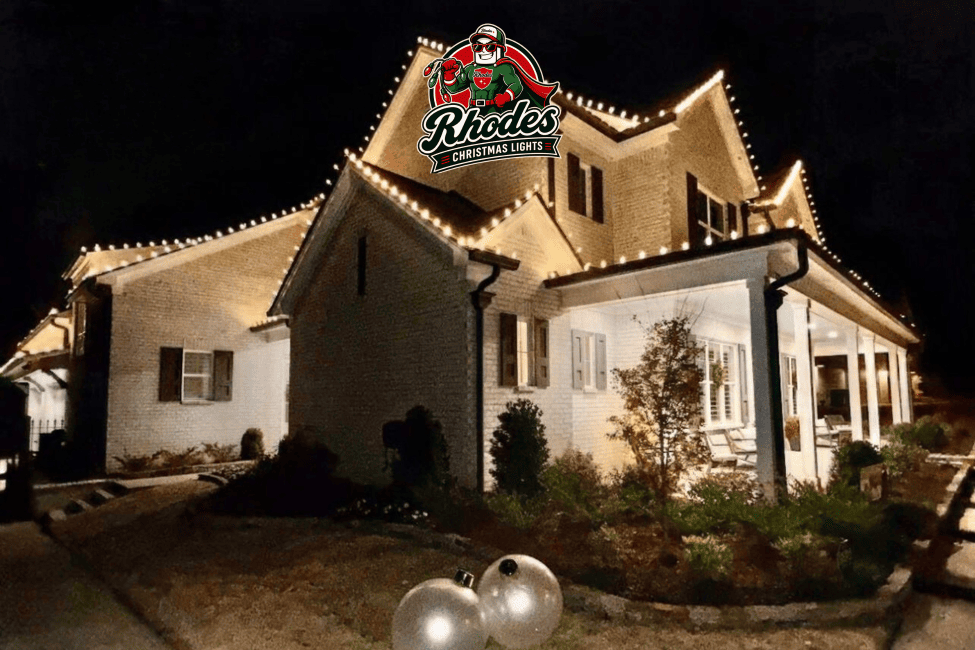 House decorated with festive Christmas lights and decorations at night.