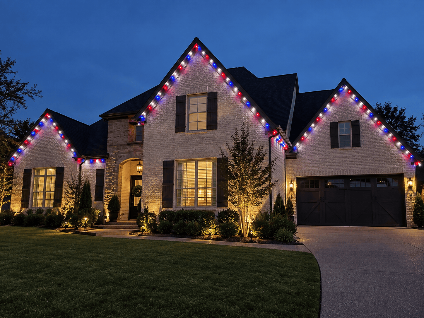 Beautiful house decorated with colorful Christmas lights at night.